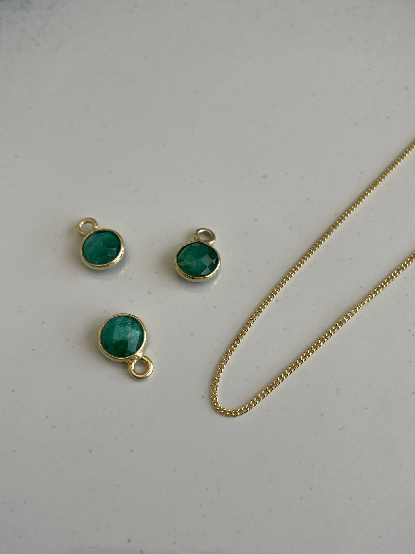 May’s Emerald In Gold